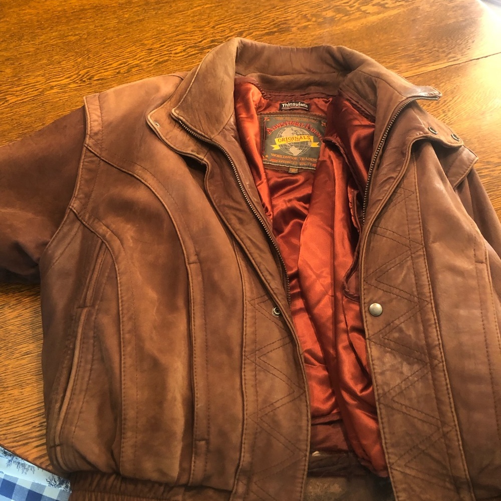 Vintage brown leather mens bomber jacket from early 80s.